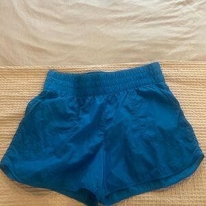 Free People vibes! Vibrant Blue Women's Athletic Shorts with pockets.